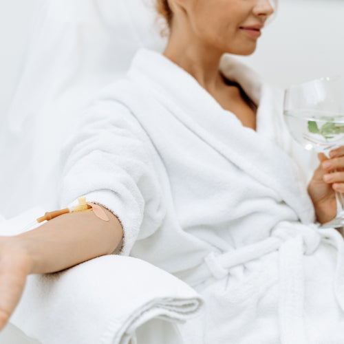 Woman receiving an IV hydration treatment
