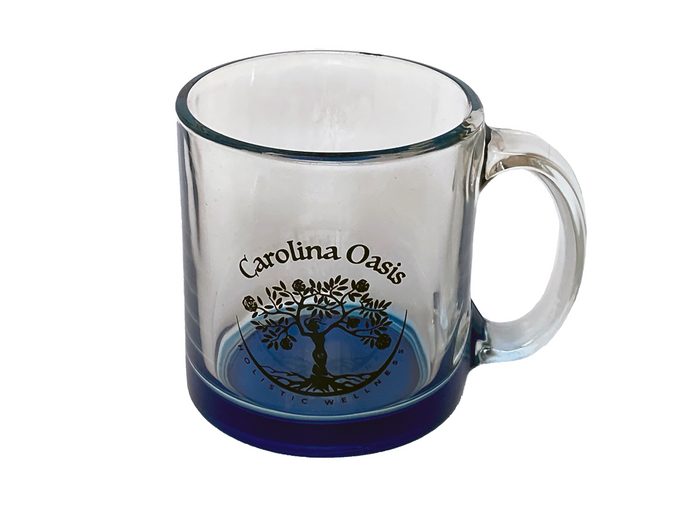 A clear, glass mug is featured with a blue base and the Carolina Oasis logo.