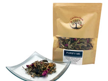 Load image into Gallery viewer, Sealed, brown bag of Purify Me tea that features the Carolina Oasis logo, the Purify Me label, and a small window to view the Purify Me ingredients. The ingredients/herbal contents are also displayed in a small clear plate in front of the bag of tea. The plate gives a more detailed view of the herbal ingredients.
